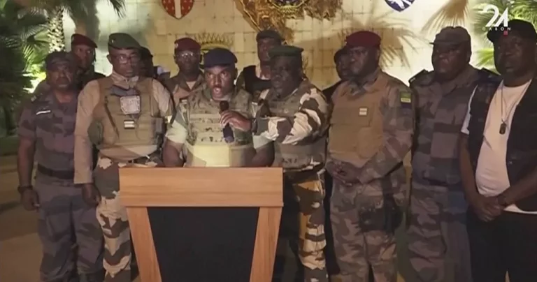 Local residents parade to greet the military in Gabon, who last night staged a military coup in the country